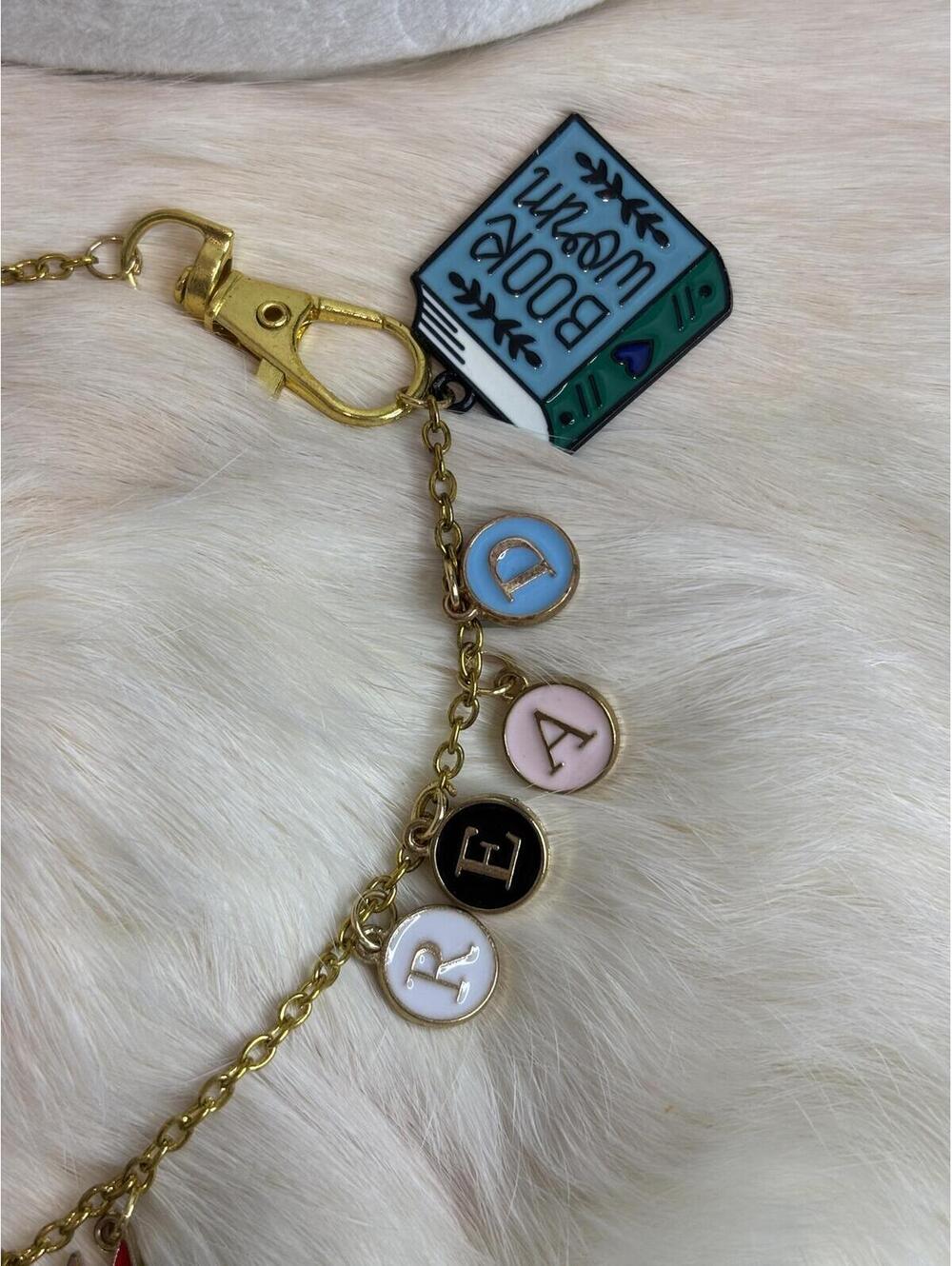 Gold Tone bag Charm with Book, Castle, and Girl Power Charms - Picture 2 of 3